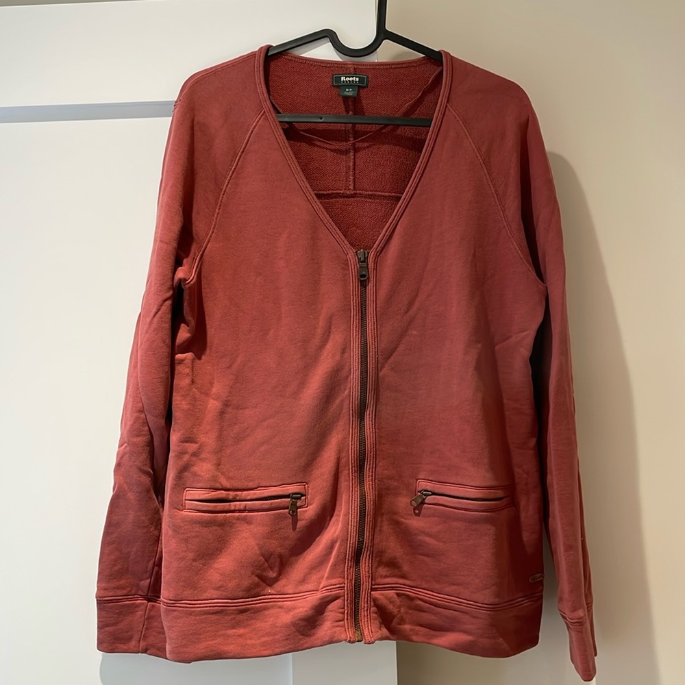 Deep pink/plum Roots zip up sweater with two zipper pockets.